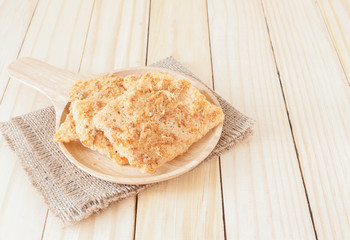 Rice with pork snack in wooden plate