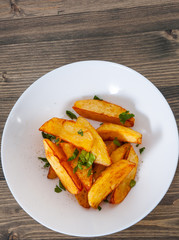 potato in a bowl on wooden background