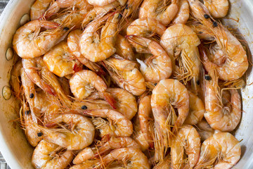Cooked shrimp in a pan with garlic and spices
