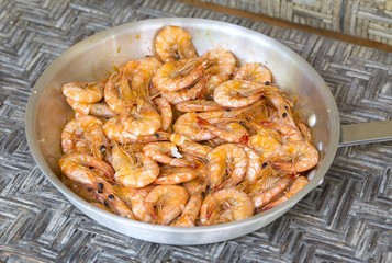 Cooked shrimp in a pan with garlic and spices