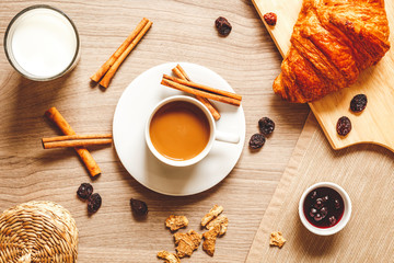 breakfast at home on wooden table with cup of coffee