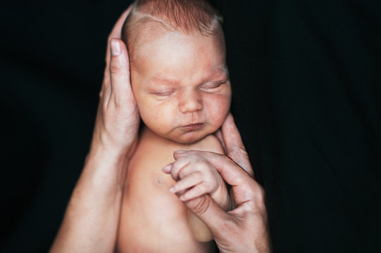 Newborn in mother's hands