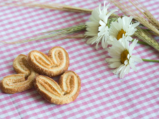Wheat ears with flowers camomile
