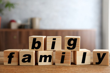 Words BIG FAMILY on wooden background