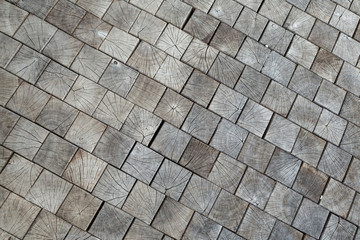inlaid wooden tiles as the background, conceptual in nature