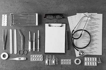Medical tools set on dark gray background