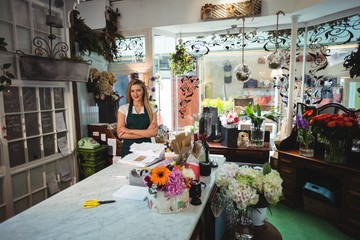 Female florist standing with arms crossed