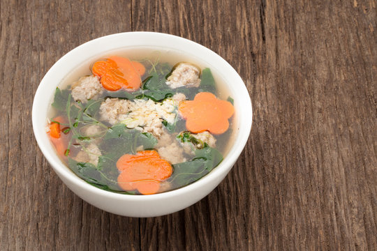  soup with pork and gourd on wooden background