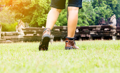 walking on green grass in summer, gradient light