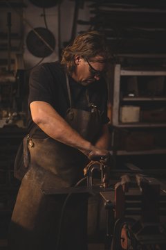 Blacksmith working on metal
