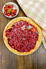 Tart cherry with berries on board top