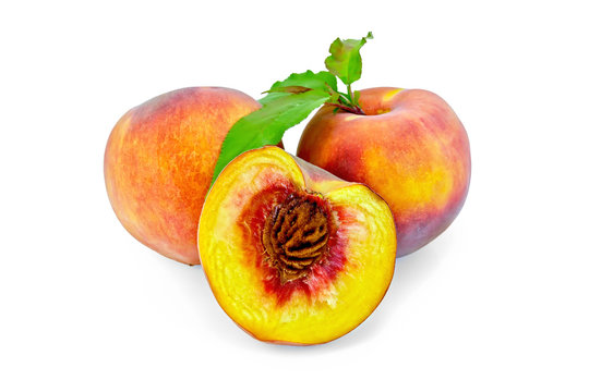 Peaches with green leaves