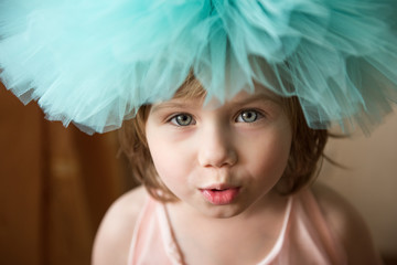 Little girl smiles at the camera.