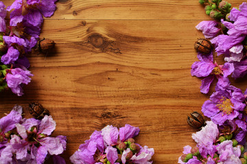 flower frame on wood background