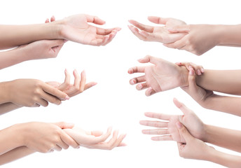 Acute pain in a woman wrist. Female holding hand to spot of wrist pain isolated on a white with clipping path.
