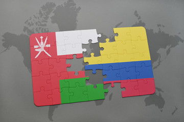 puzzle with the national flag of oman and colombia on a world map background.