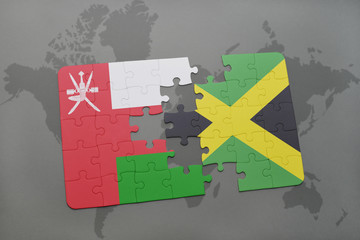 puzzle with the national flag of oman and jamaica on a world map background.