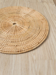 weave tray on warm wood background