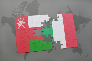 puzzle with the national flag of oman and italy on a world map background.