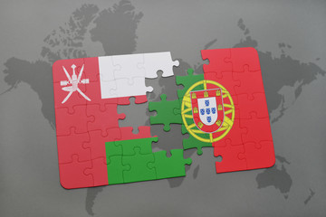 puzzle with the national flag of oman and portugal on a world map background.