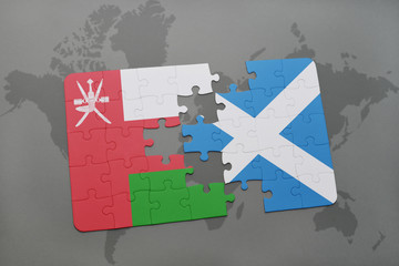 puzzle with the national flag of oman and scotland on a world map background.