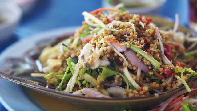 Thai cuisine seafood dish, mango papaya spicy salad with Horseshoe Crab (Limulidae) eggs