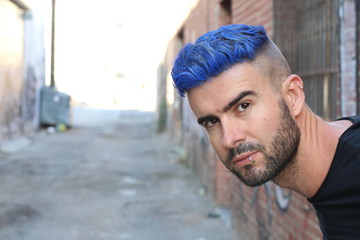 Blue haired guy walk on old rusty forsaken barges