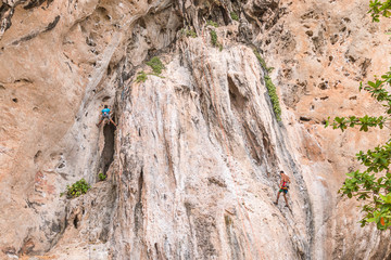 RAILAY, THAILAND - May 4, 2016: Rock climbers climbing the wall