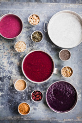Breakfast bowl colorful collage with Superfoods and purple acai smoothie recipe.