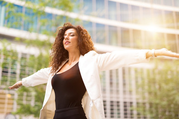 Woman opening her arms and relaxing