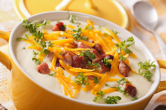 potato soup with bacon and cheese in a pot macro. horizontal
