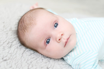 Portrait of lovely blue-eyed 1 months baby