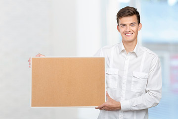 happy businessman with corkboard