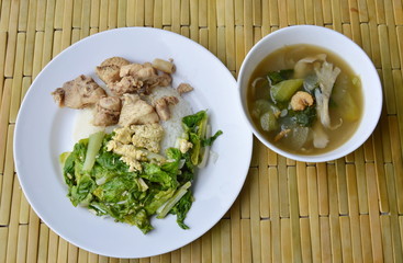 stir fried Chinese cabbage and salty chicken on rice eat with mixed vegetable soup