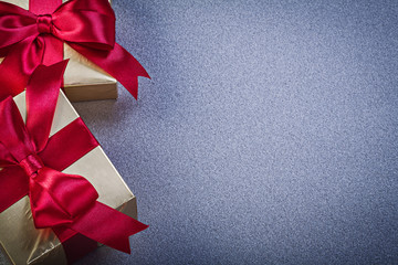 Boxed gifts on grey background copy space holidays concept