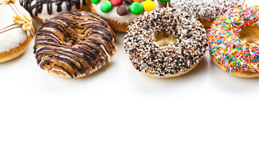 various donuts on white background