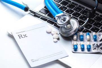 Medical stethoscope on computer keyboard