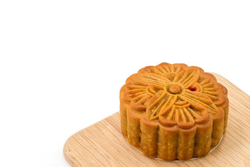 Mooncake on wooden plate for the chinese Mid Autumn festival, on white background