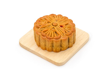 Mooncake on wooden plate for the chinese Mid Autumn festival, on white background