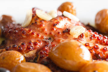 traditional portuguese dish octopus with potato on white plate