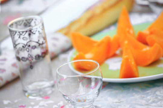 delicious Cantaloupe melon slices on the plate on table