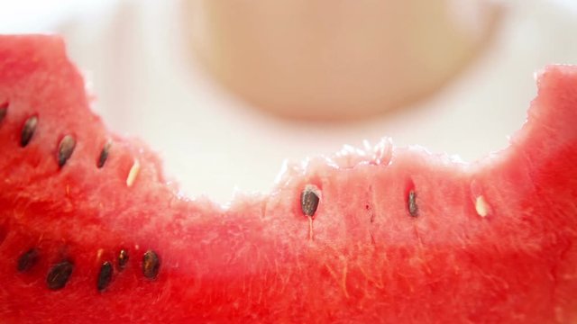 Little boy's eating ripe mellow watermelon with appetite