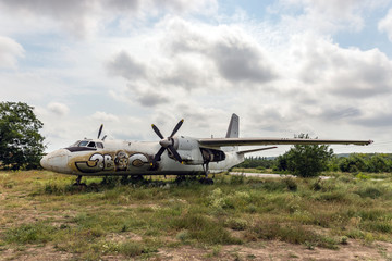 Fototapeta na wymiar Older aircraft flying in an abandoned airport