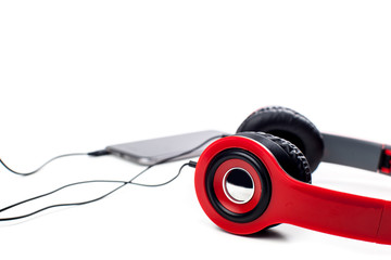 Naklejka premium audio player with headphones isolated on white background
