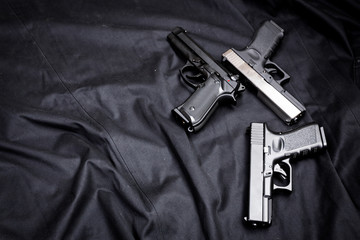 handgun on black background