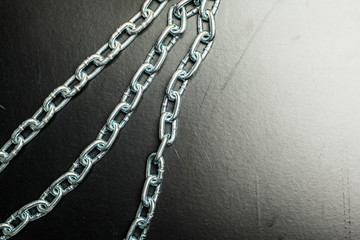Fototapeta na wymiar chains on a black background