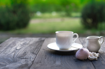 Cup of black tea with marshmallows cooked at home