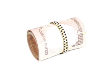 Roll of Indian rupees isolated on white