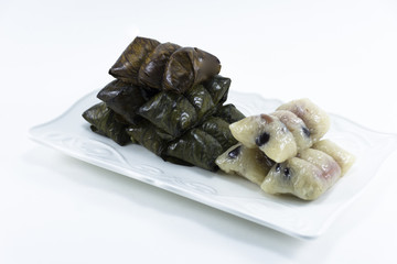 Dessert from banana leave dish Koaw-tom-mud isolated on white background snack original of Thai