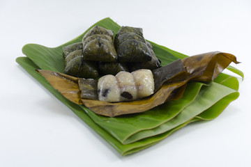 Dessert from banana leave Koaw-tom-mud isolated on white background snack original of Thai